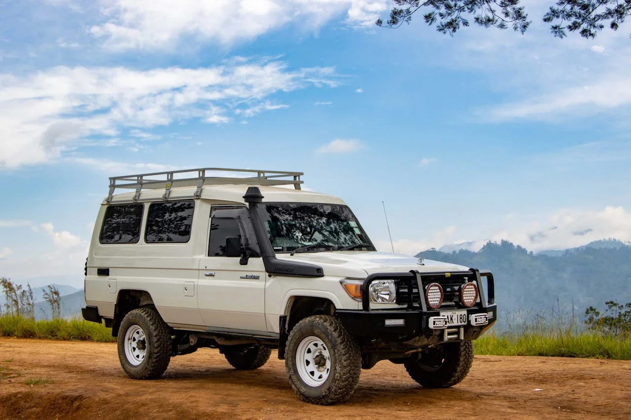 Toyota Land Cruiser 4x4 on a mountain road in Uganda