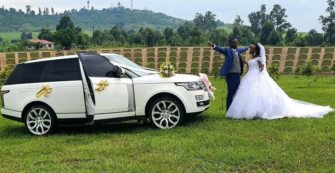 Wedding Range Rover with bride and groom